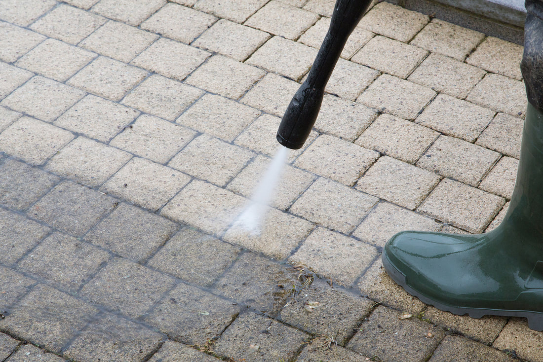 Brick power washing by professional cleaner